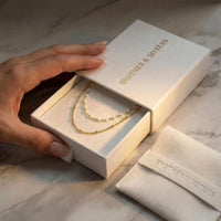 Thumbnail for Double Layer Choker by Brother & Sisters in elegant packaging with gold chains and enamel beads.