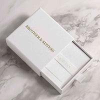 Thumbnail for Love Photo Necklace in elegant Brother & Sisters packaging on a marble surface.