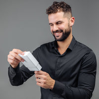 Thumbnail for Man in a black shirt excitedly opening a gift box, celebrating the moment - Classic Photo Bracelet by Brother & Sisters.