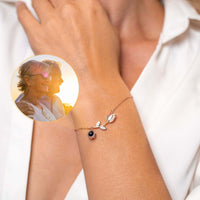 Thumbnail for Tulip Photo Bracelet worn on wrist, featuring tulip charm and hidden photo projection for personalized memories by Brother & Sisters.