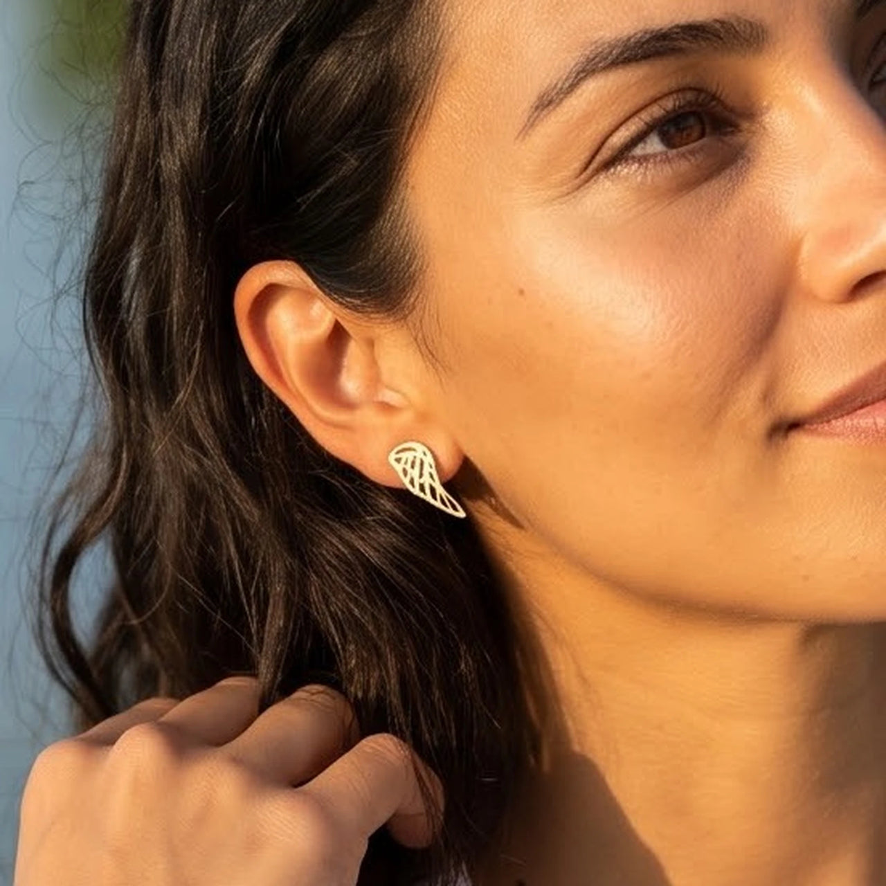 The gold stud earrings worn, close-up | SKU: 42008-gold