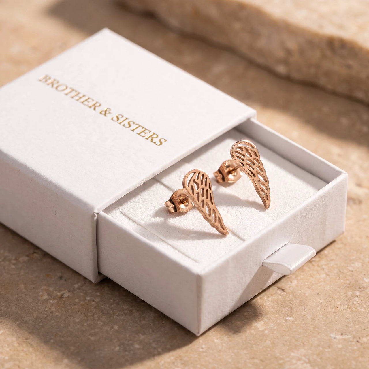 The rose gold stud earrings in the Brother & Sisters gift box | SKU: 42008-rose-gold
