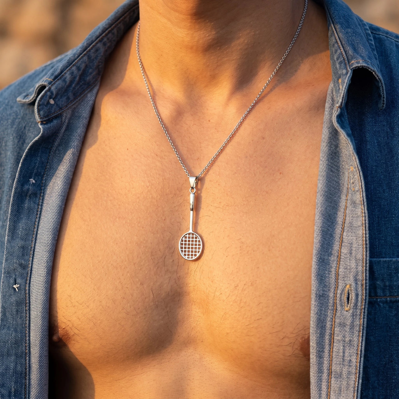 Badminton Racket Necklace Silver – close-up worn on a man's wrist | Brother & Sisters | SKU: White Gold