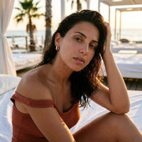 Thumbnail for Chunky Dome Hoops in Gold, worn at a beach club at sunset | SKU: 41005-gold