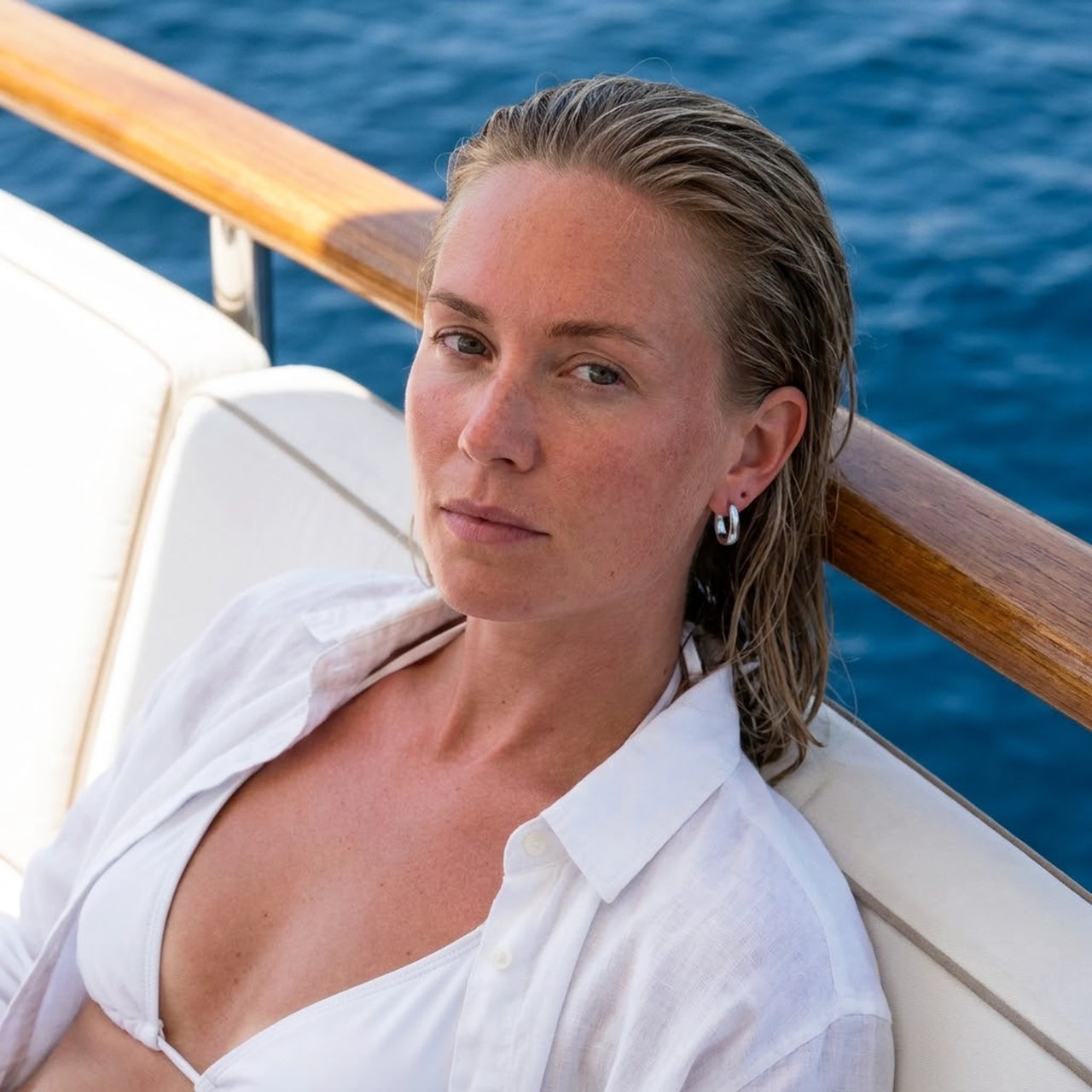 Chunky Dome Hoops in Silver, worn on a yacht | SKU: 41005-silver