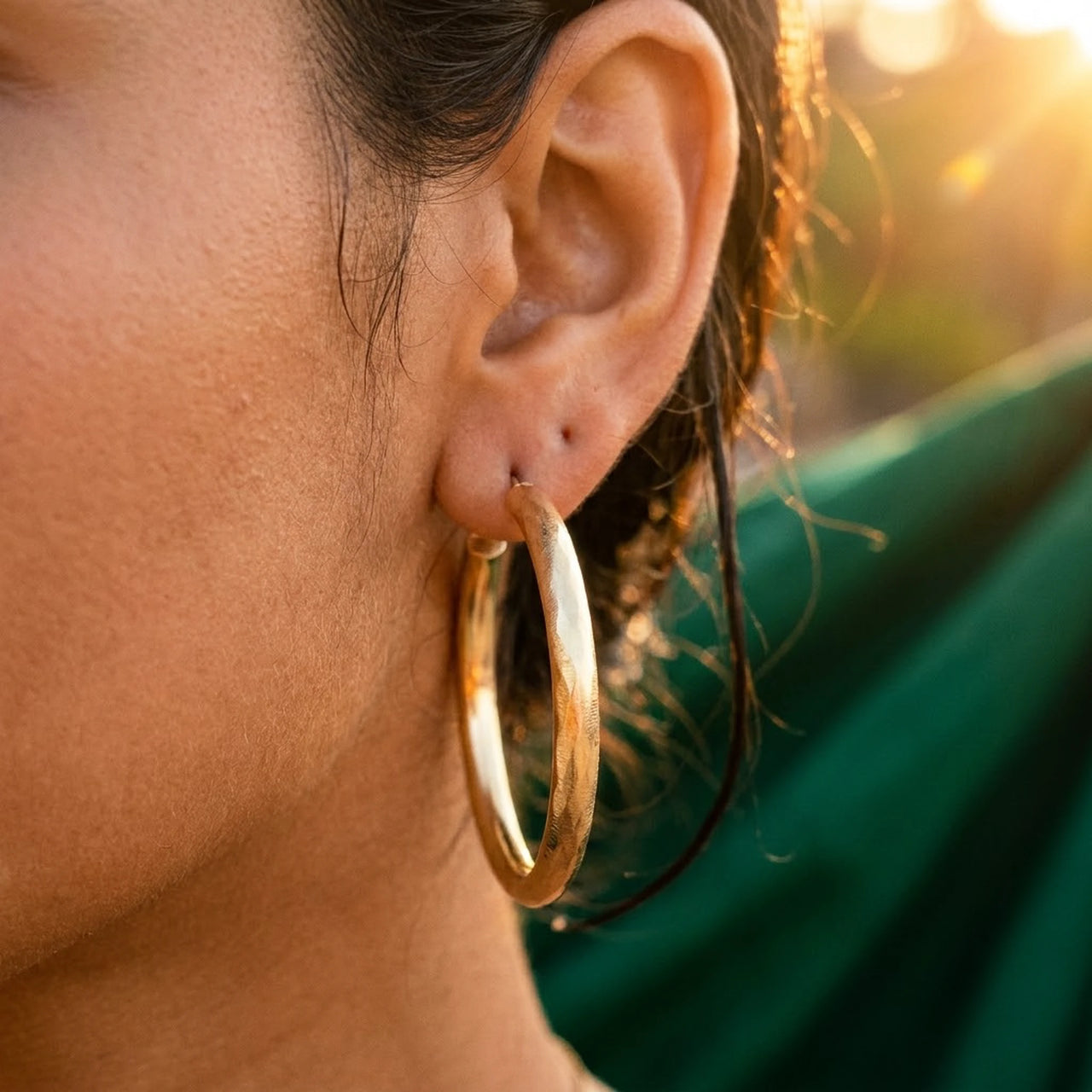 Diamond Cut Statement Hoops in Gold, close-up on the earlobe | SKU: 41009-gold