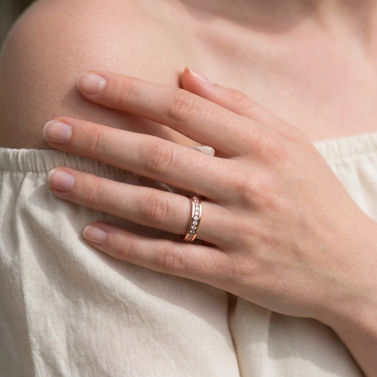 Close-up of the Engagement Ring with Crystals in rose gold worn | SKU: 25535390-5-rose-gold