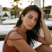 Thumbnail for Everyday Waterproof Hoops in Gold, worn at a beach club at sunset | SKU: 41001-gold