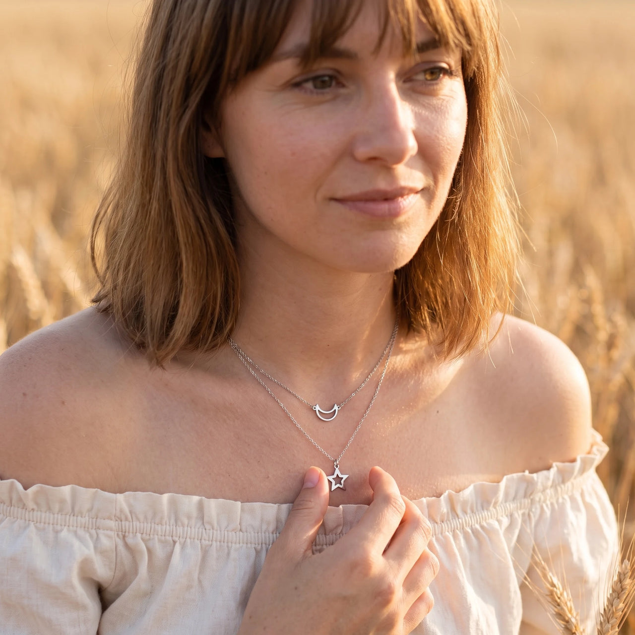 Crescent moon necklace — worn, everyday gesture, silver | SKU: letoile-wg