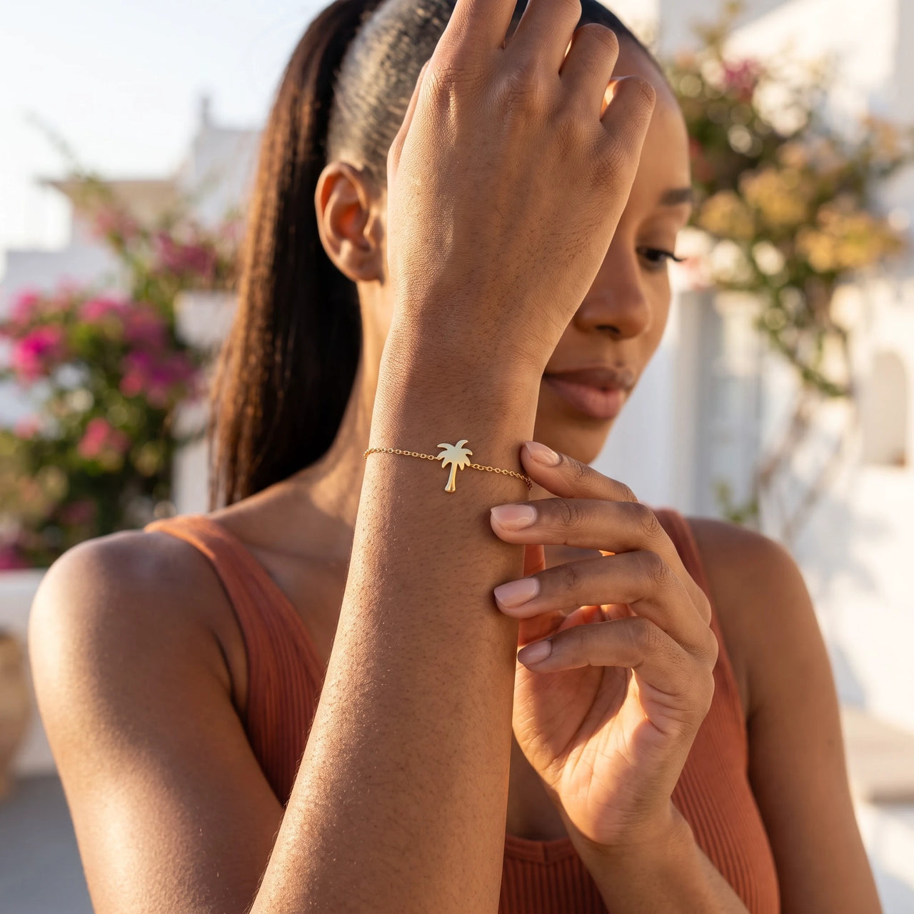 Palm tree jewellery — worn, everyday gesture, gold | SKU: 7819407-gold-color