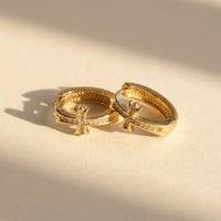 Thumbnail for Pave Cross Huggie Hoops in Gold, product photo | SKU: 41006-gold