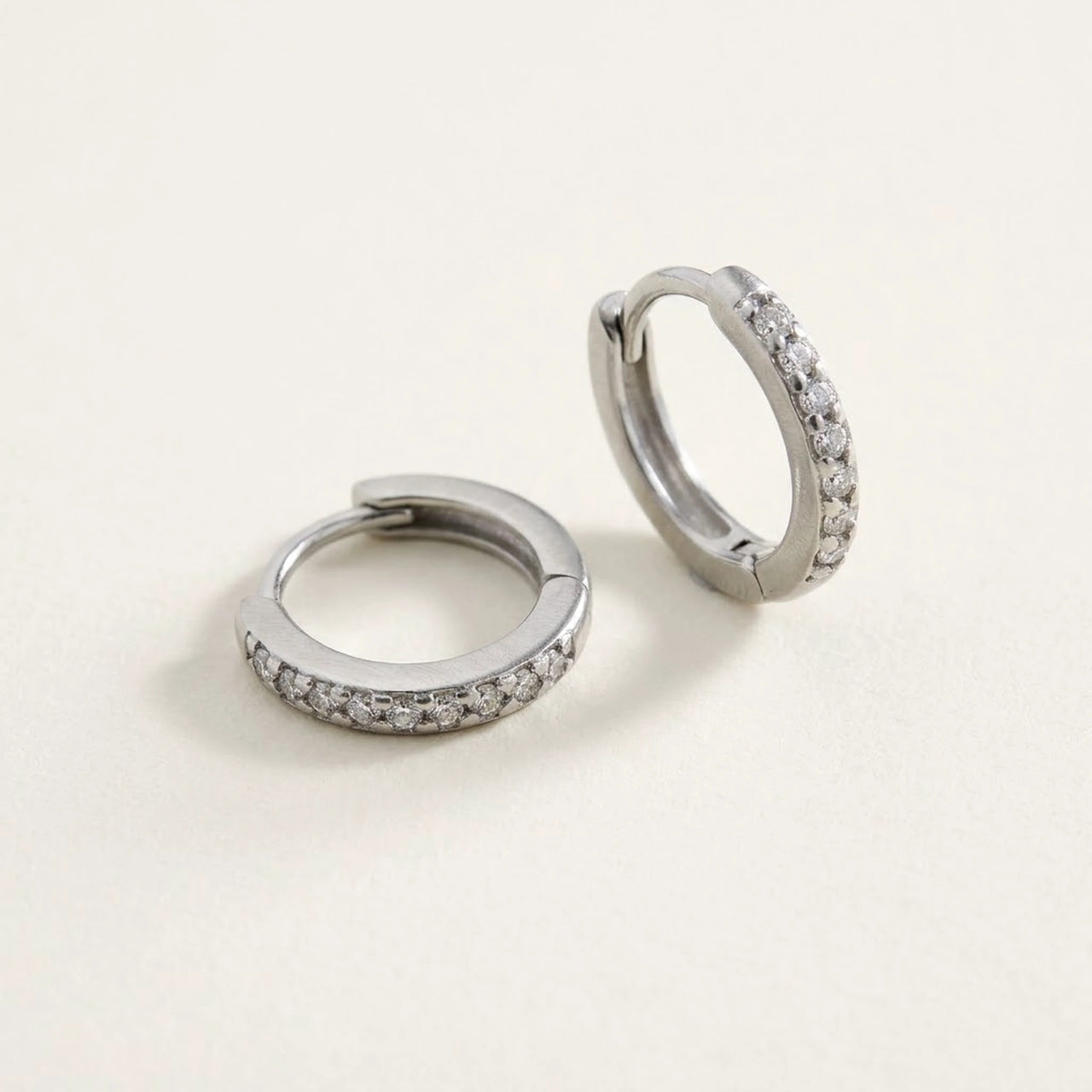 Pave Huggie Hoop Earrings in Silver, product photo | SKU: 41011-silver