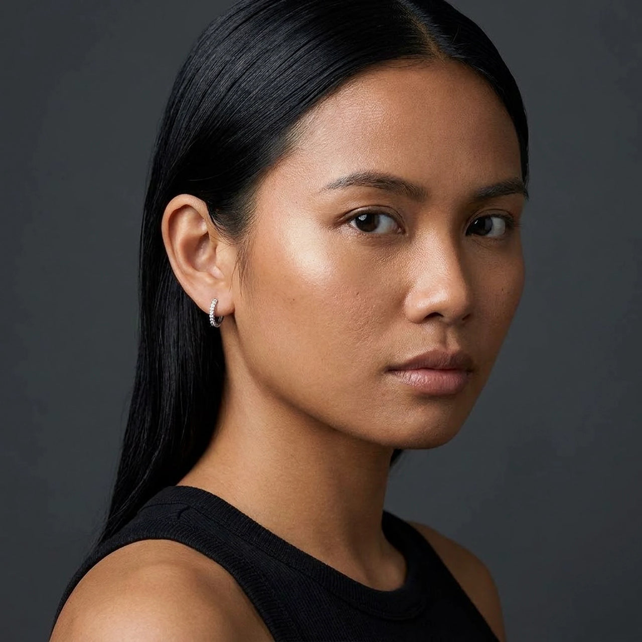 Pave Huggie Hoop Earrings in Silver, studio portrait | SKU: 41011-silver