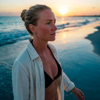 Thumbnail for Pave Huggie Hoop Earrings in Silver, worn on the beach | SKU: 41011-silver
