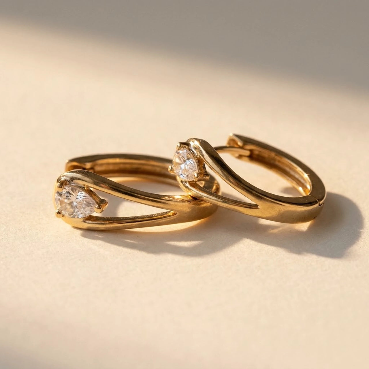 Pear Crystal Huggie Hoops in Gold, product photo | SKU: 41007-gold