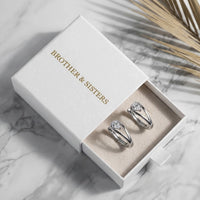 Thumbnail for Pear Crystal Huggie Hoops in Silver, in the gift box | SKU: 41007-silver