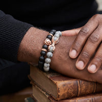 Thumbnail for Rose Gold Lion with Black & Grey Stones Set – close-up worn on a man's wrist | Brother & Sisters | SKU: 21369621-rose-gold-XS-14-15, 21369621-rose-gold-S-16-17, 21369621-rose-gold-M-18-19, 21369621-rose-gold-L-20-21, 21369621-rose-gold-XL-22-23