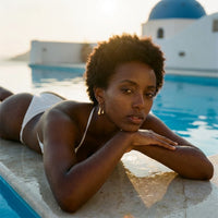 Thumbnail for Sculpted Crescent Drops in Gold, worn by a pool in Santorini | SKU: 41008-gold