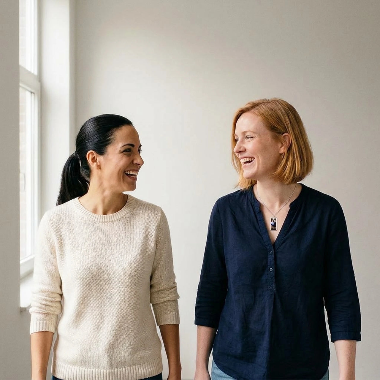 Two friends smiling over their childhood photo in the silver bar necklace | SKU: TPH-BARN-SILVER