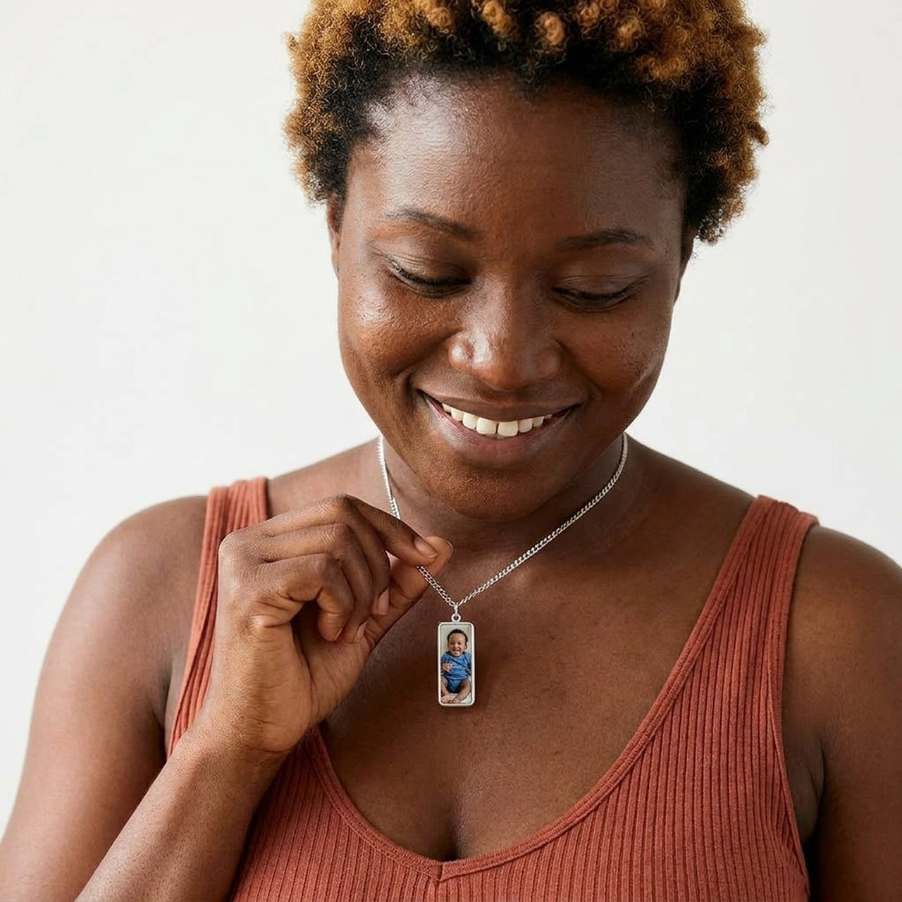 Woman wearing the silver bar photo necklace with her baby's photo | SKU: TPH-BARN-SILVER