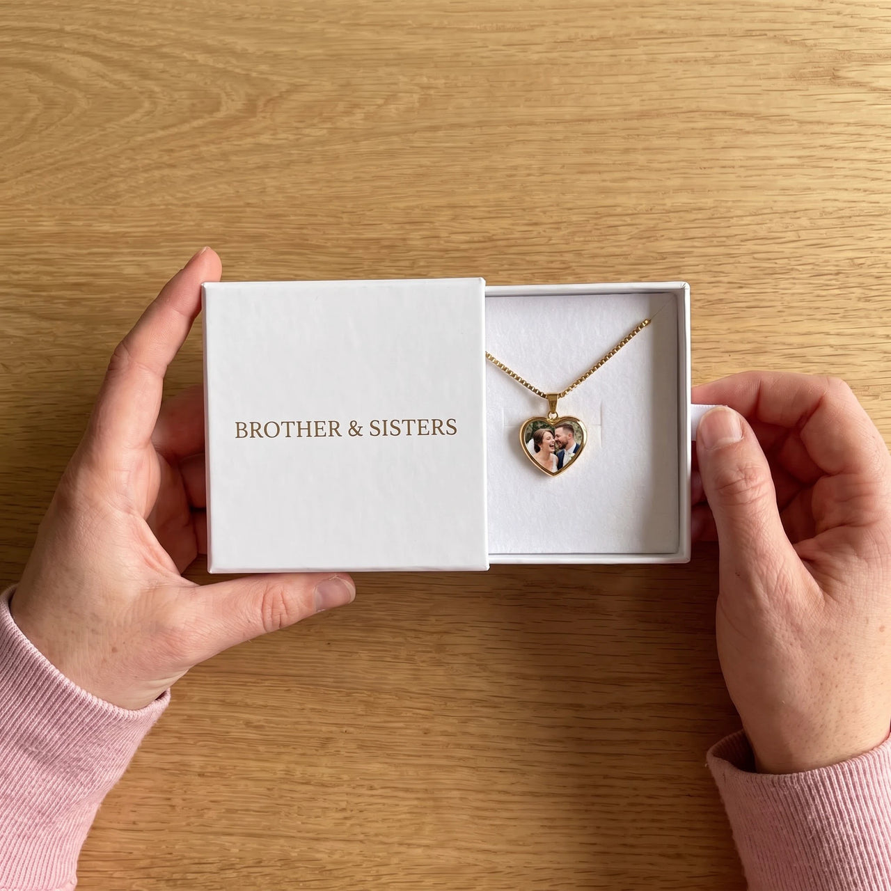 The gold heart photo necklace with a wedding photo in the Brother & Sisters gift box | SKU: TPH-CHTN-GOLD-SMALL