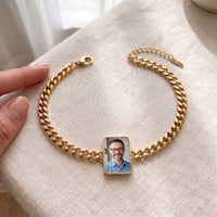 Thumbnail for The gold cushion-cut photo bracelet laid flat, shown open with its lobster clasp and extender, her father's photo in the charm | SKU: TPH-CUSB-GOLD