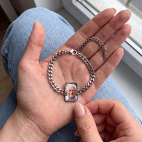 Thumbnail for The silver cushion-cut photo bracelet in her palm, a fingertip warming the charm to reveal her grandfather's photo | SKU: TPH-CUSB-SILVER