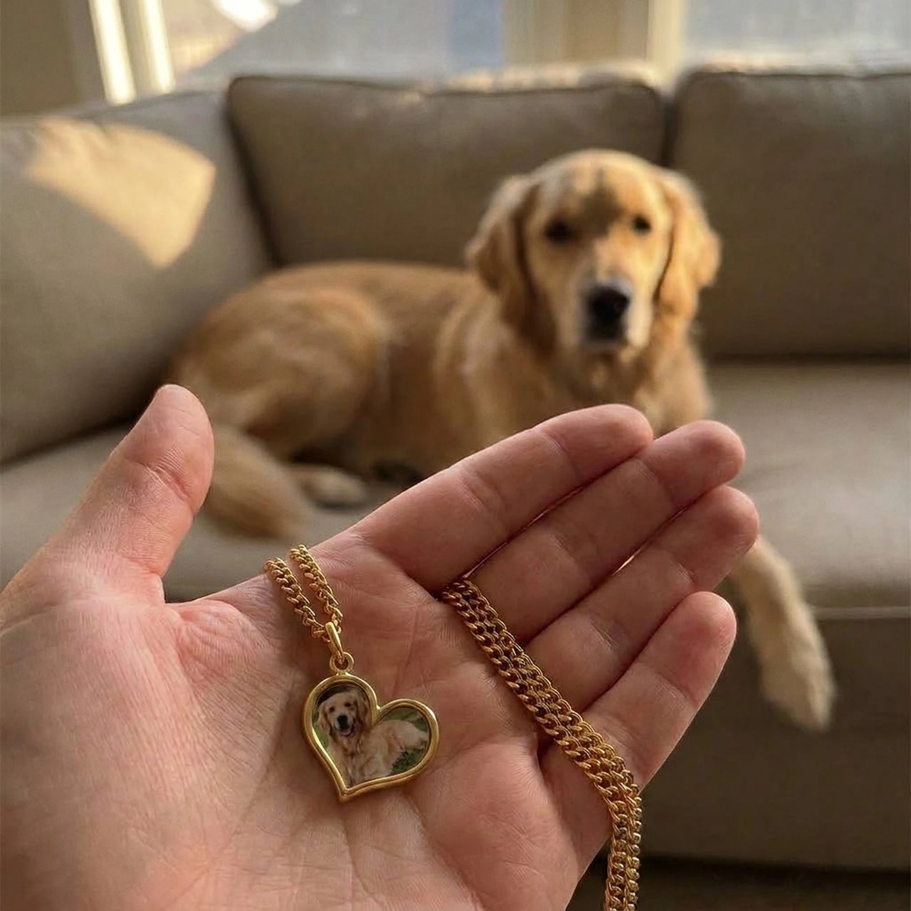 Customer photo: the gold secret heart necklace with her dog's photo, her dog in the background | SKU: TPH-HRTN-GOLD
