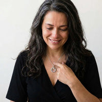 Thumbnail for Woman moved as she looks at her late grandmother's photo in the silver octagon necklace | SKU: TPH-OCTN-SILVER