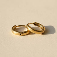 Thumbnail for Tiny Huggie Hoops in Gold, product photo | SKU: 41002-gold