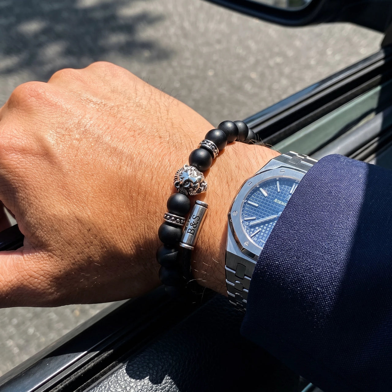 White Gold Lion & Black Stones Bracelet – worn next to a luxury watch | Brother & Sisters | SKU: 20712286-silver-XS-14-15, 20712286-silver-S-16-17, 20712286-silver-M-18-19, 20712286-silver-L-20-21, 20712286-silver-XL-22-23